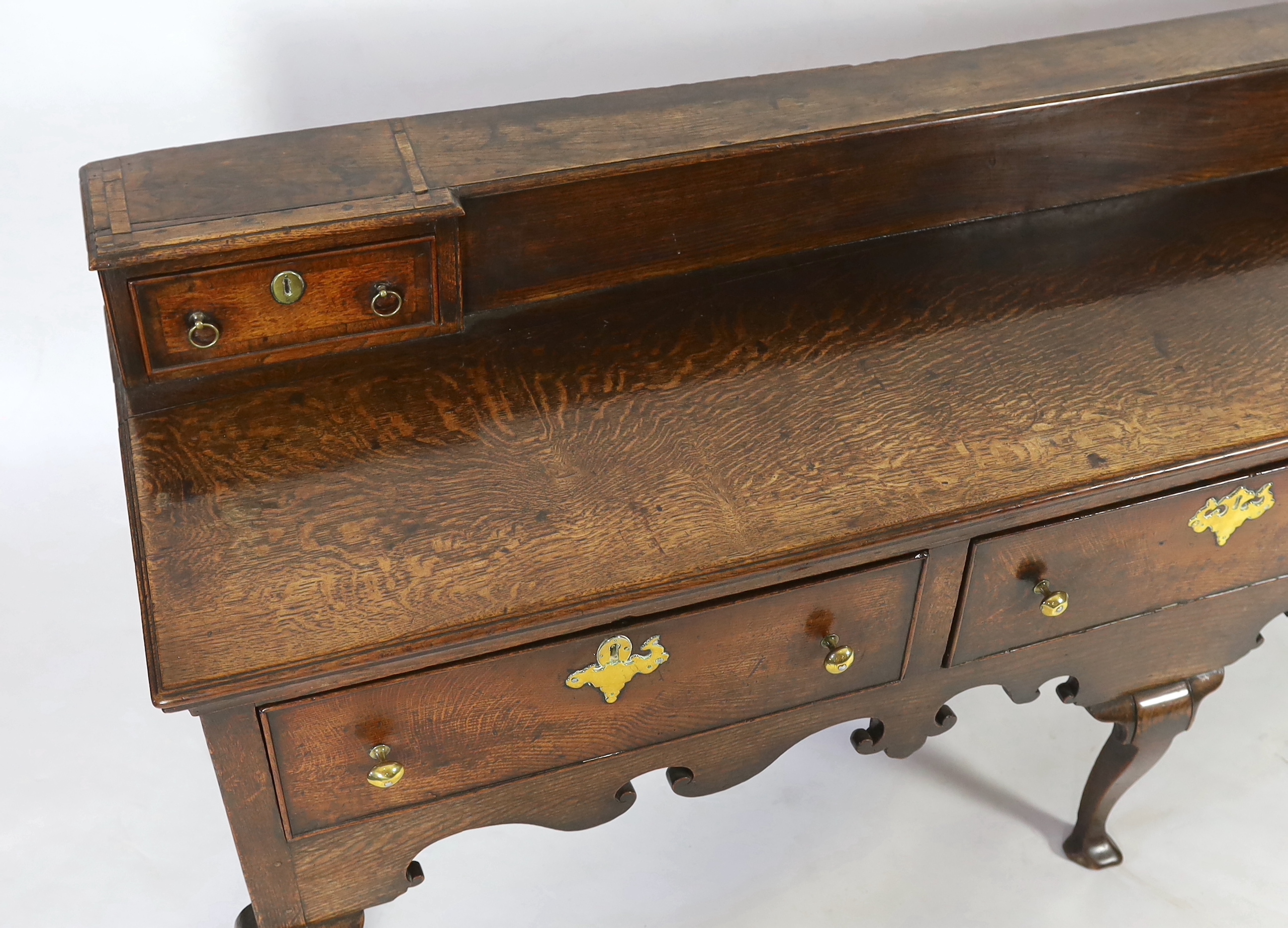 A late 18th century oak dresser base